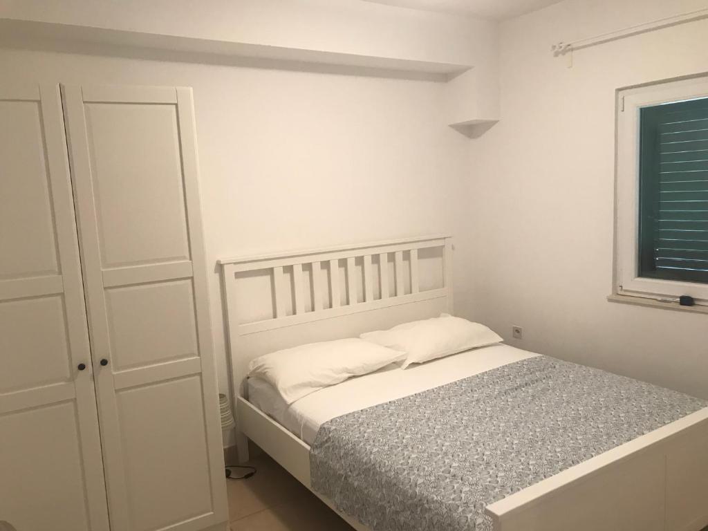 Postel nebo postele na pokoji v ubytování Guesthouse Davorka Bijelić