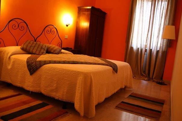Postel nebo postele na pokoji v ubytování Albergo Duomo