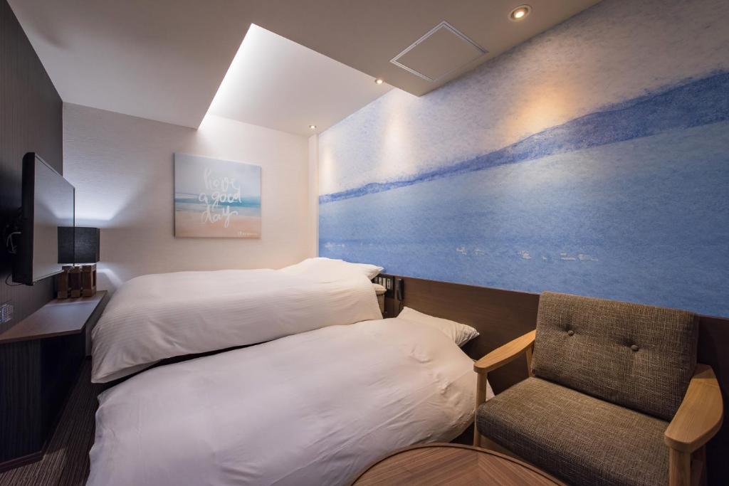Postel nebo postele na pokoji v ubytování Enoca Hotel