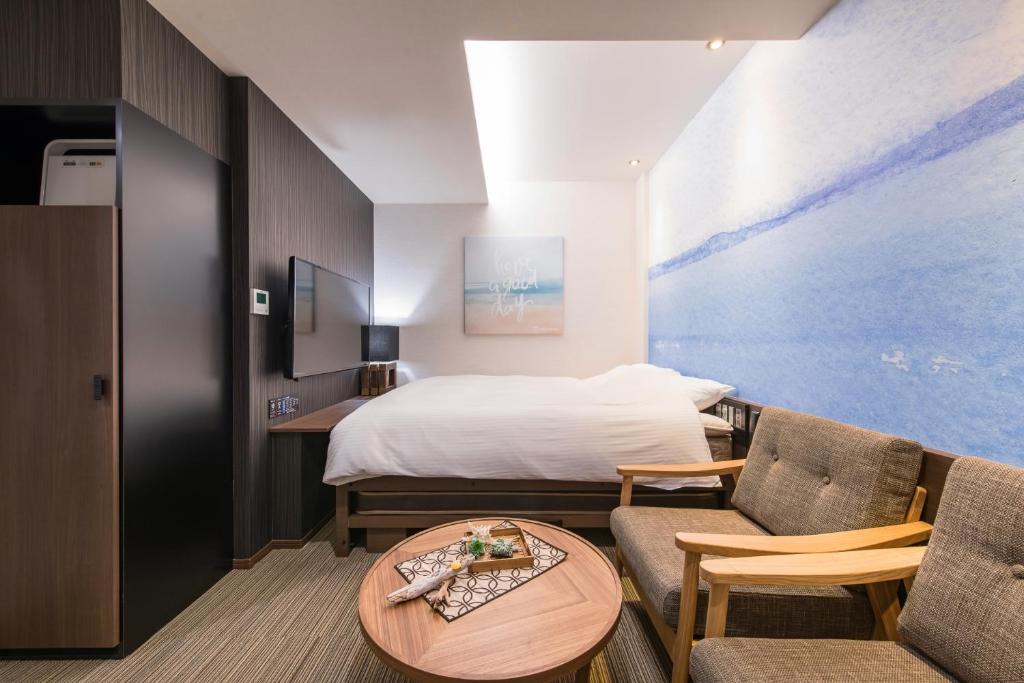 Postel nebo postele na pokoji v ubytování Enoca Hotel