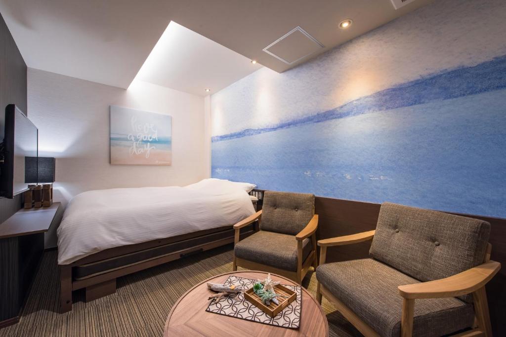 Postel nebo postele na pokoji v ubytování Enoca Hotel