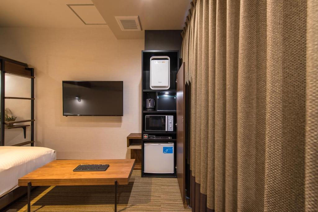 Kuchyň nebo kuchyňský kout v ubytování Enoca Hotel