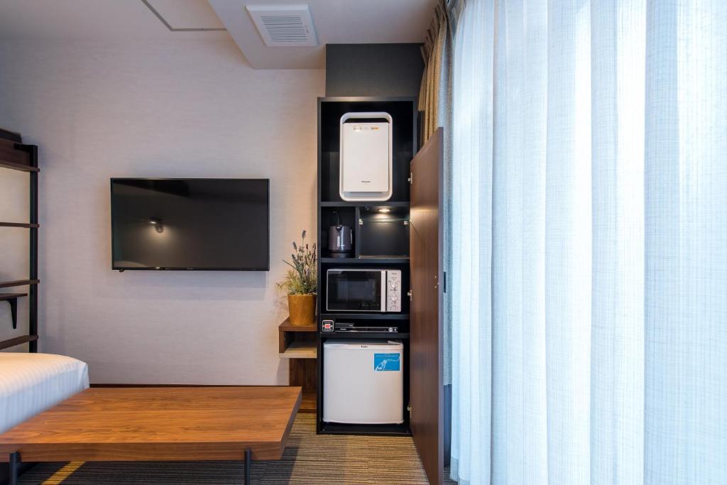Kuchyň nebo kuchyňský kout v ubytování Enoca Hotel