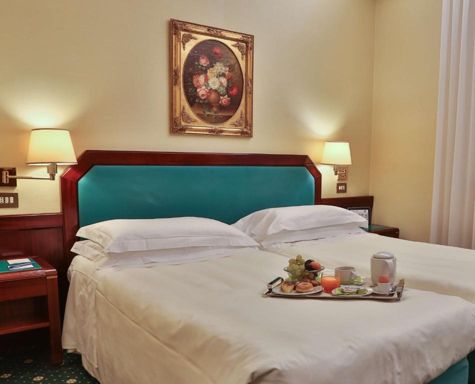Postel nebo postele na pokoji v ubytování Hotel Astoria Sure Hotel Collection By Best Western