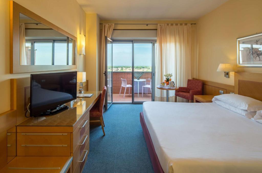 Posteľ alebo postele v izbe v ubytovaní Best Western Hotel I Triangoli