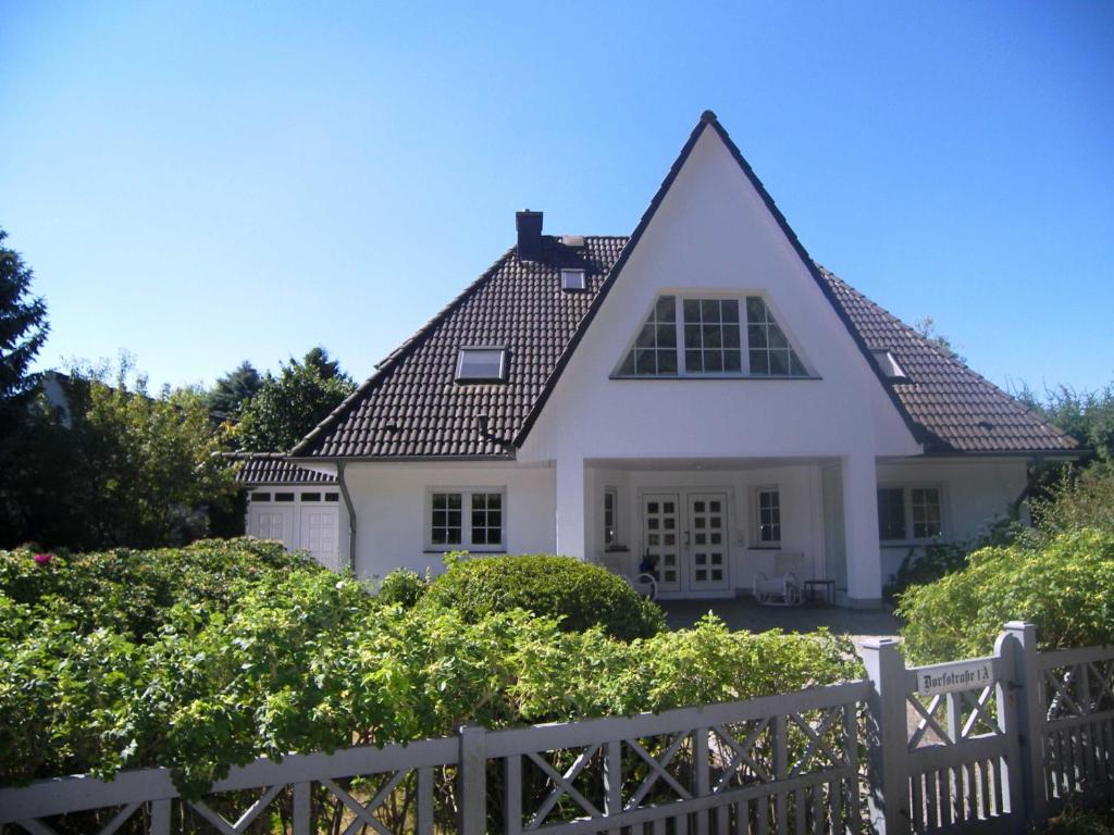a white house with a brown roof at Ferienhaus 1A in Gothen