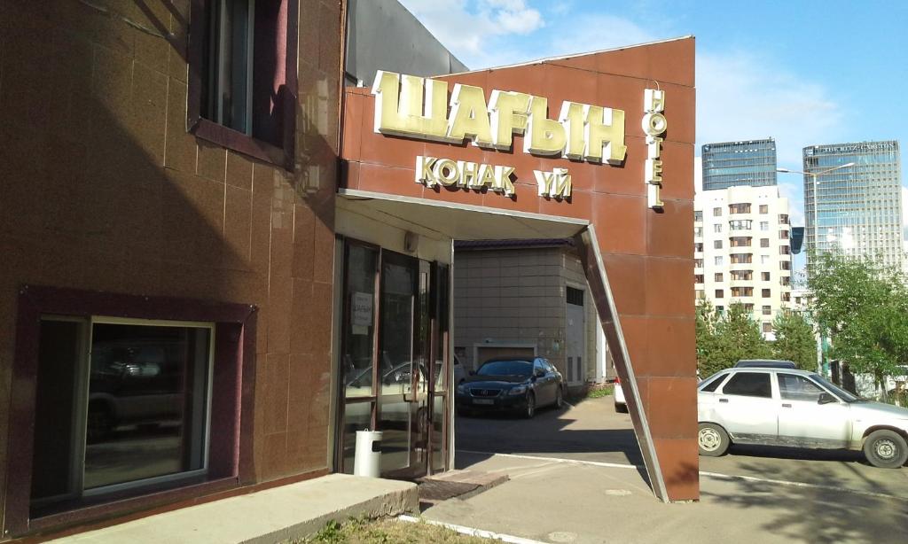 a building with a sign for a hyundai dealership at Hotel Shagyn in Astana