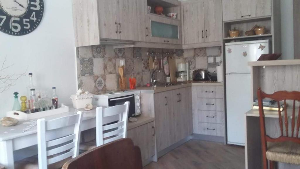 Kuchyň nebo kuchyňský kout v ubytování Violetta Rooms