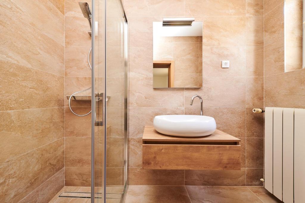 a bathroom with a sink and a shower at Ribarska Koliba - Villa Marija in Pula