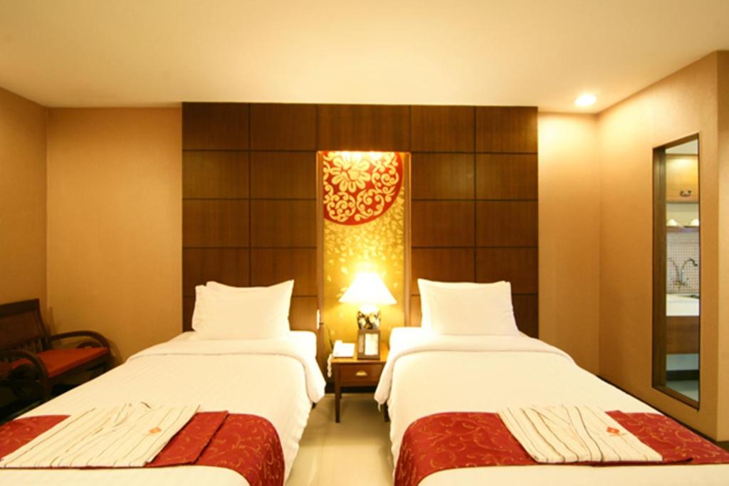 Postel nebo postele na pokoji v ubytování Mariya Boutique Hotel At Suvarnabhumi Airport