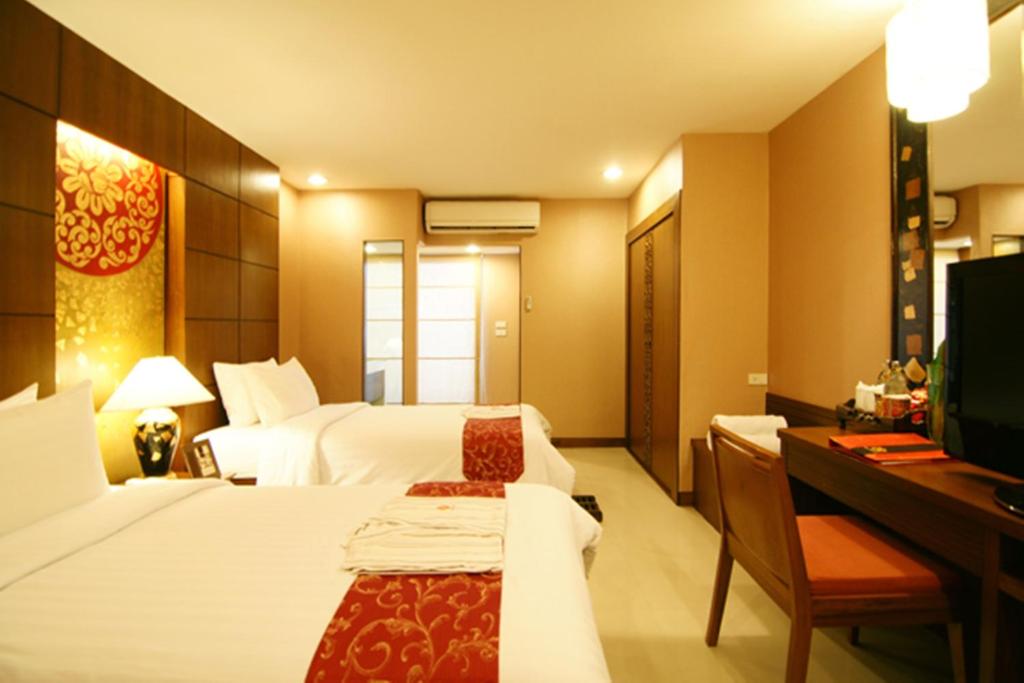Postel nebo postele na pokoji v ubytování Mariya Boutique Hotel At Suvarnabhumi Airport