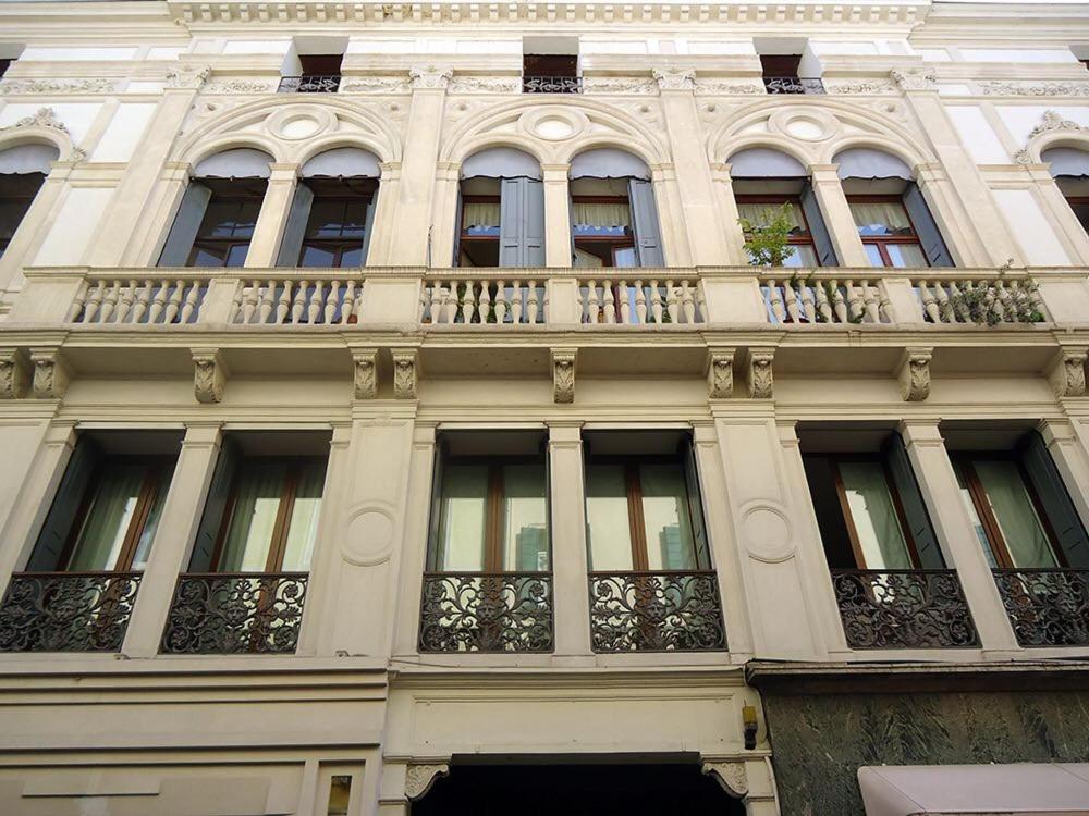 a large building with a balcony on the side of it at Canton del Gallo in Padova