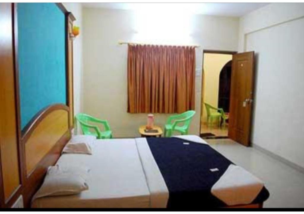 מיטה או מיטות בחדר ב-Hotel Pankaj