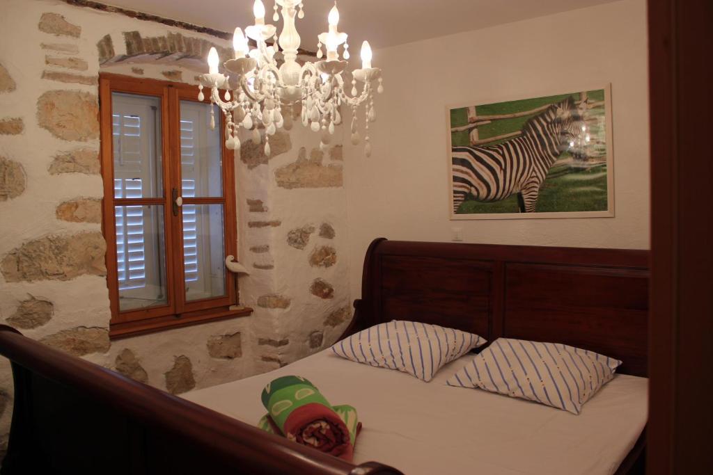 Postel nebo postele na pokoji v ubytování Villa Lošinj