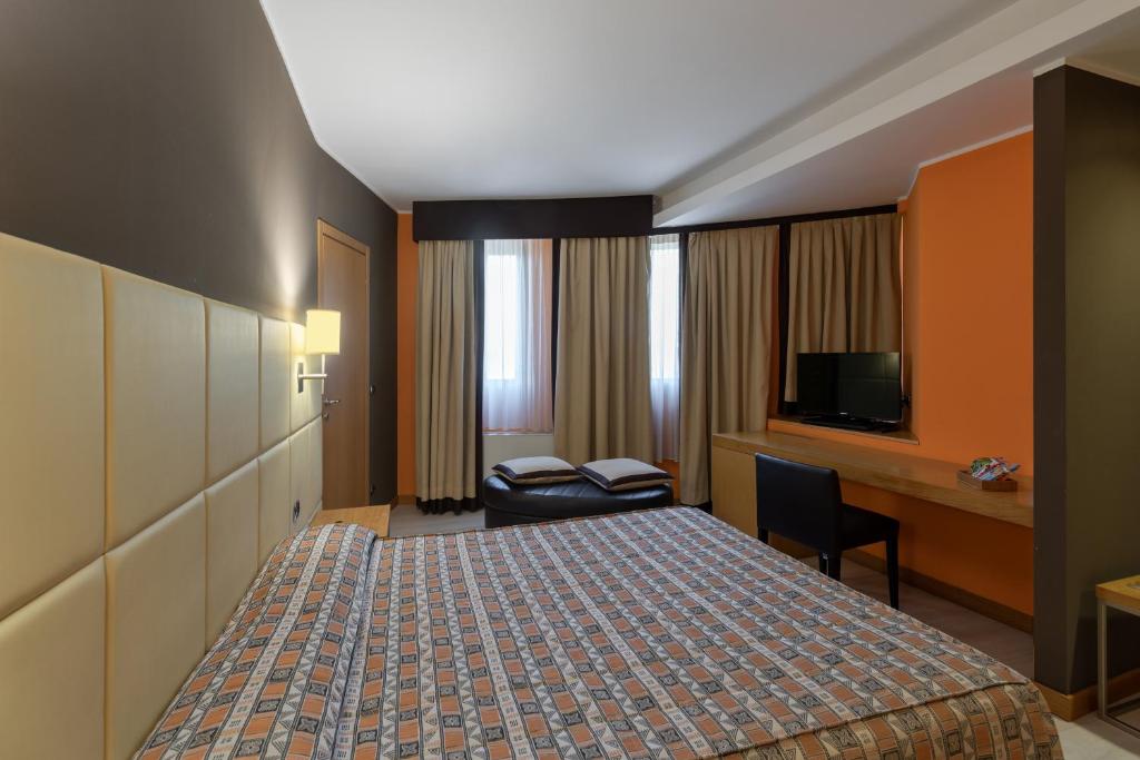 Postel nebo postele na pokoji v ubytování Hotel Motel Futura