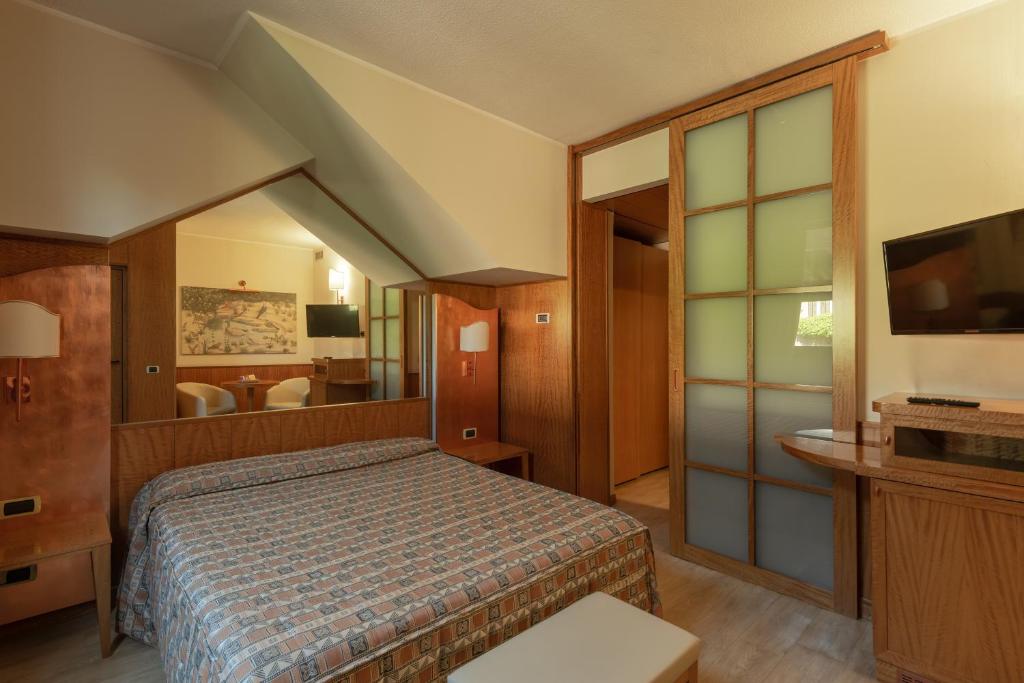 Postel nebo postele na pokoji v ubytování Hotel Motel Futura