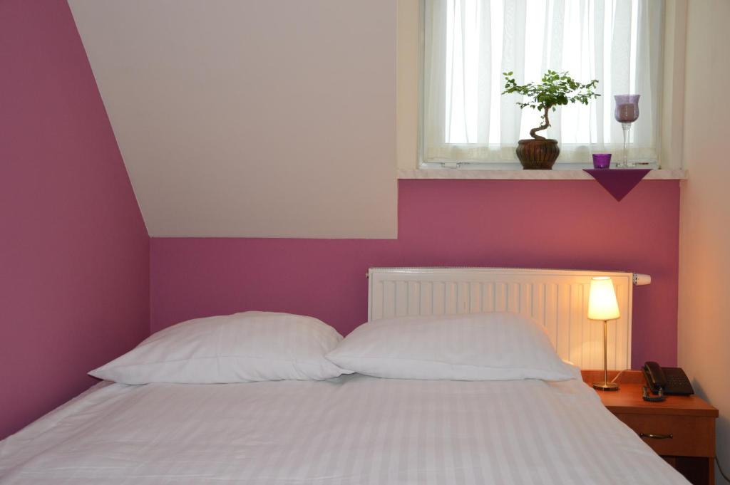 Łóżko lub łóżka w pokoju w obiekcie Hotel Vistula