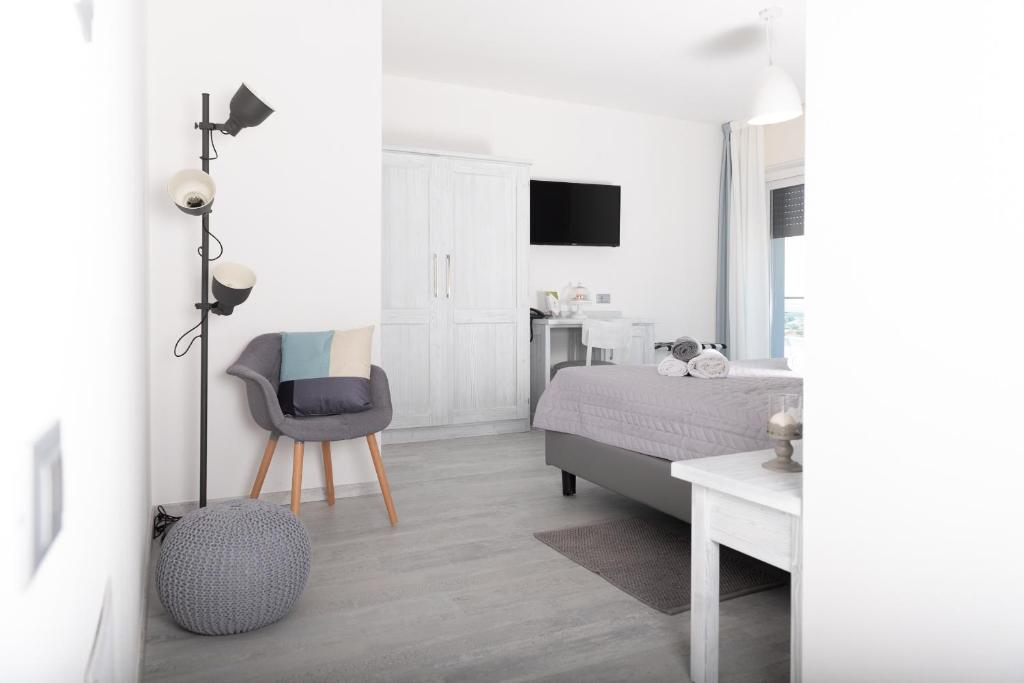 TV a/nebo společenská místnost v ubytování Hotel Gli Ulivi