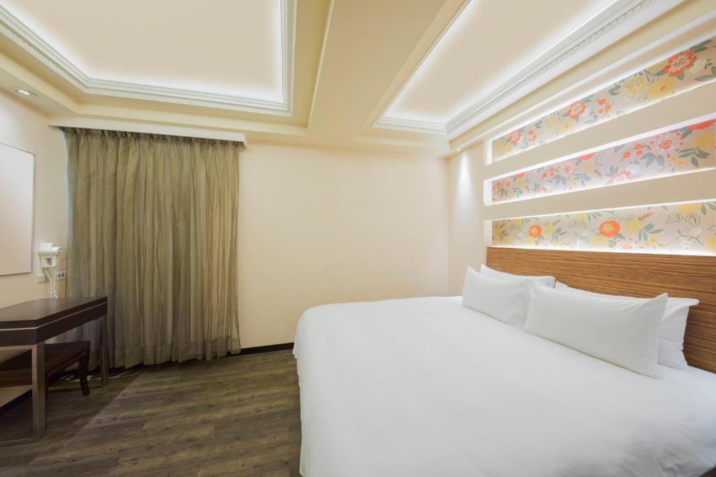 Postel nebo postele na pokoji v ubytování Bitan Hotel
