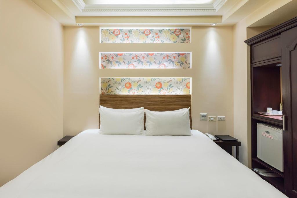 Ein Bett oder Betten in einem Zimmer der Unterkunft Bitan Hotel
