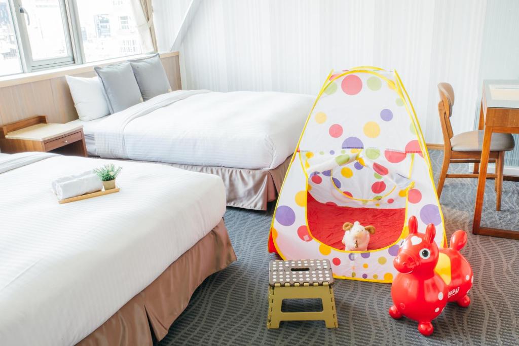 Postel nebo postele na pokoji v ubytování Muzik Hotel - Ximending Xining Branch