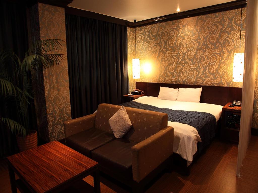 Postel nebo postele na pokoji v ubytování Hotel Cuna Kyoto Love Hotel