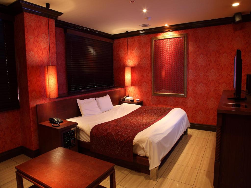 Postel nebo postele na pokoji v ubytování Hotel Cuna Kyoto Love Hotel