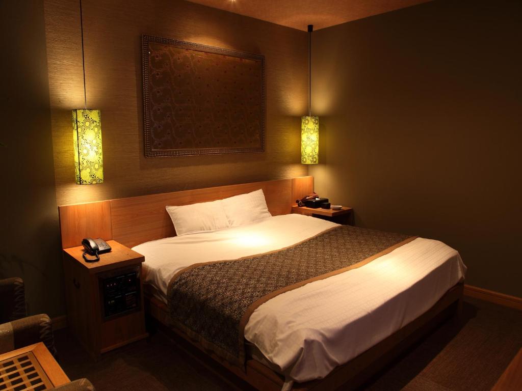 Postel nebo postele na pokoji v ubytování Hotel Cuna Kyoto Love Hotel