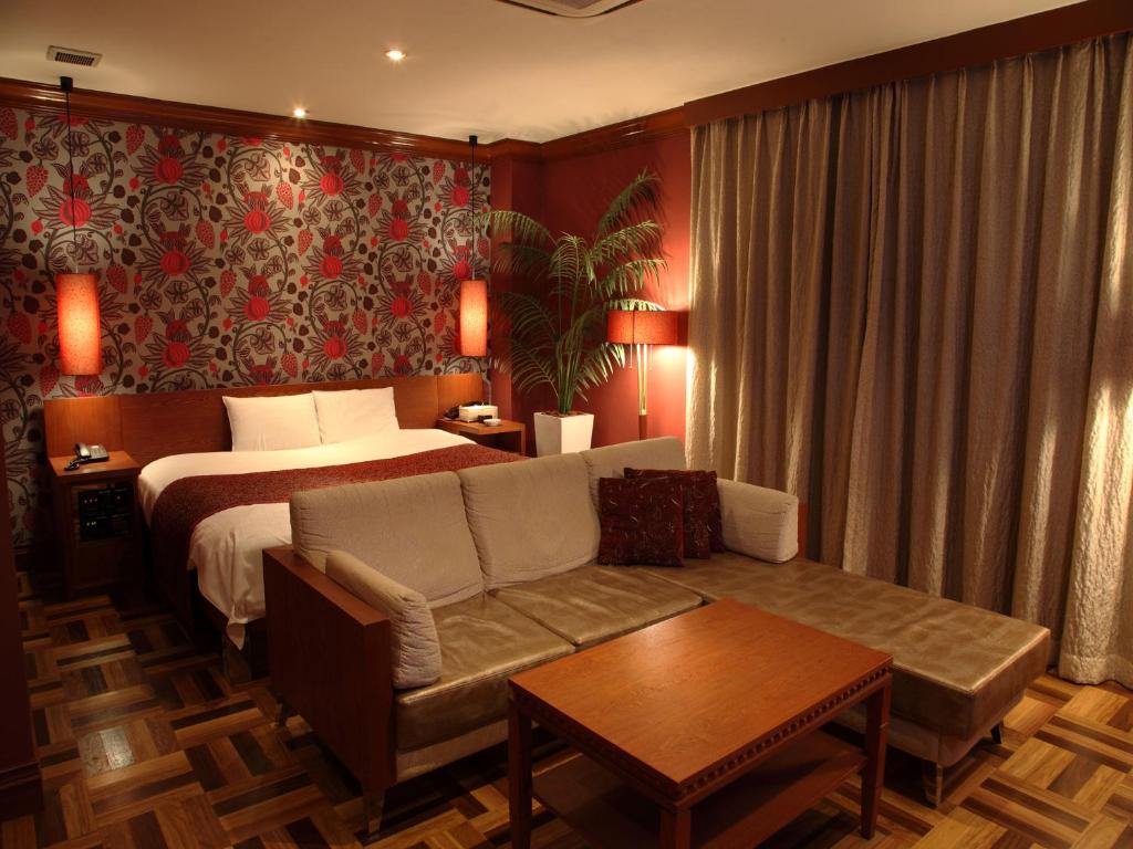 Postel nebo postele na pokoji v ubytování Hotel Cuna Kyoto Love Hotel
