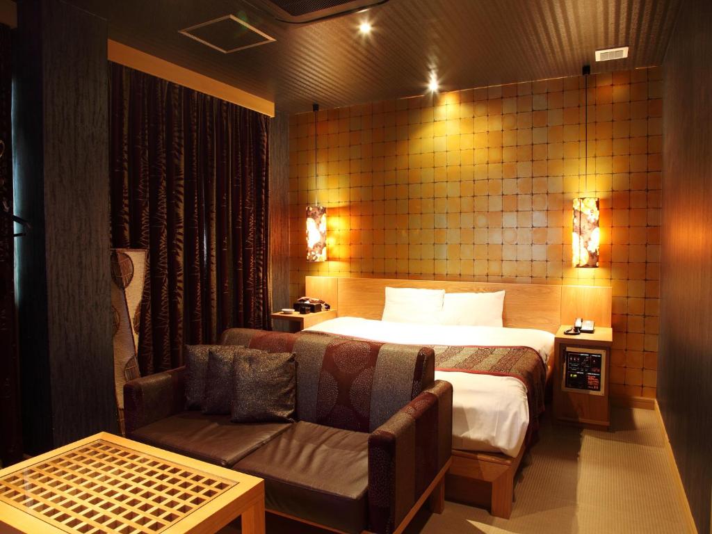 Postel nebo postele na pokoji v ubytování Hotel Cuna Kyoto Love Hotel