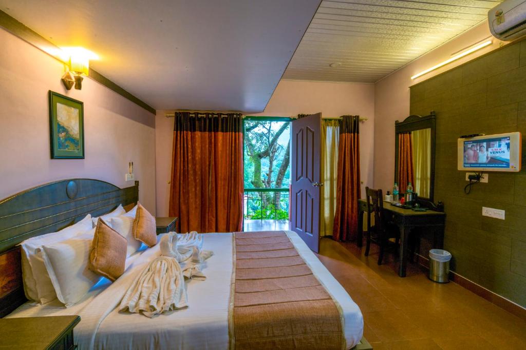 Postel nebo postele na pokoji v ubytování Upavan Resort