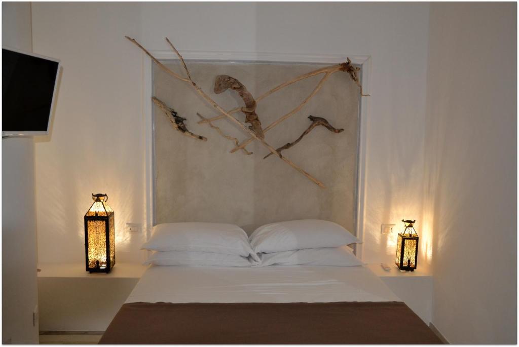 Postel nebo postele na pokoji v ubytování Quintessenza - Charme Rooms