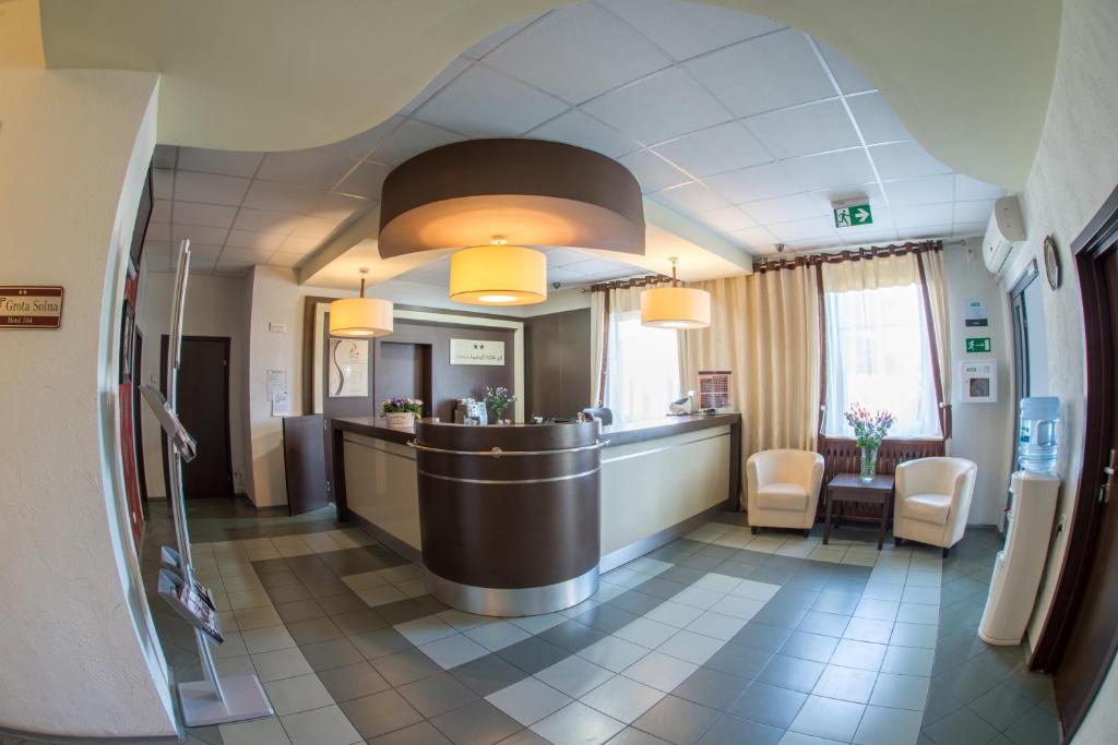 a hospital room with a bar and a waiting area at Hotel 104 in Stargard