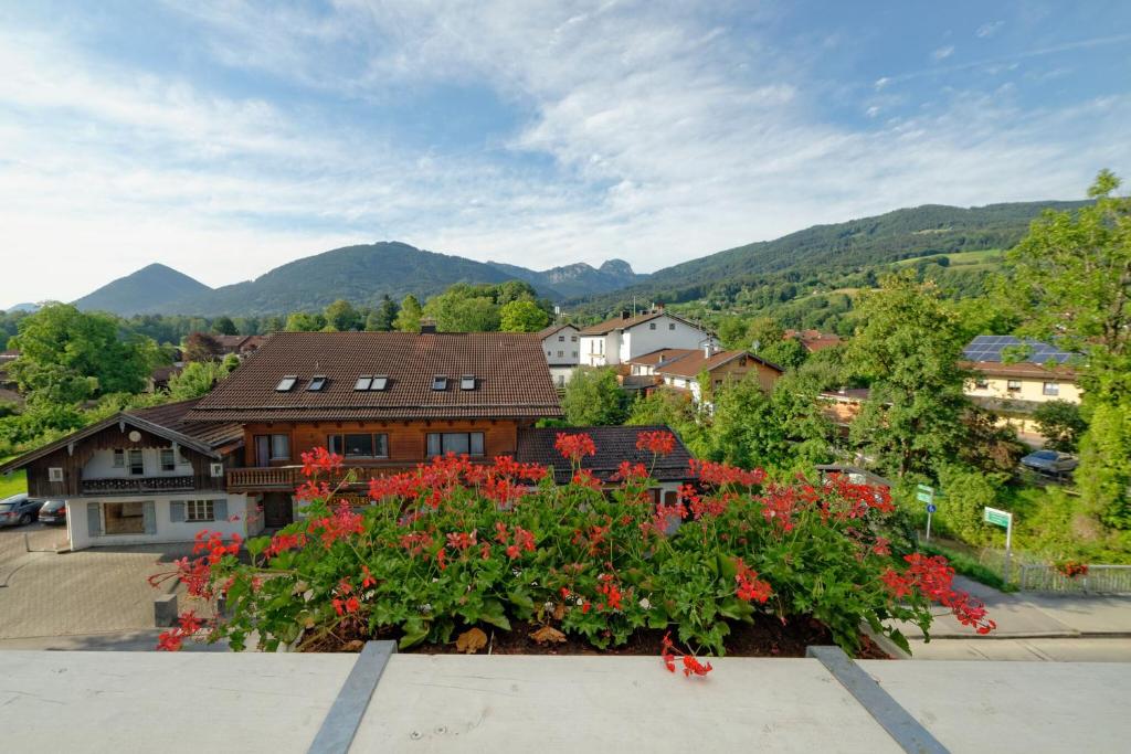 a view from the roof of a house with flowers at Hotel Bayerisch Meran in Bad Feilnbach