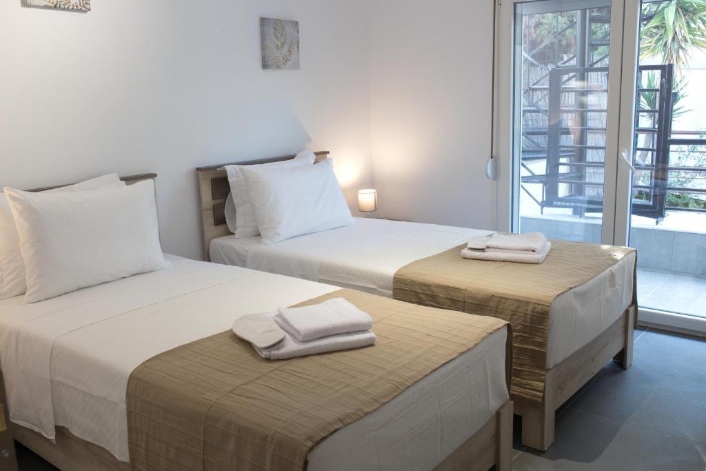 Posteľ alebo postele v izbe v ubytovaní Blue4Aqua Apartments