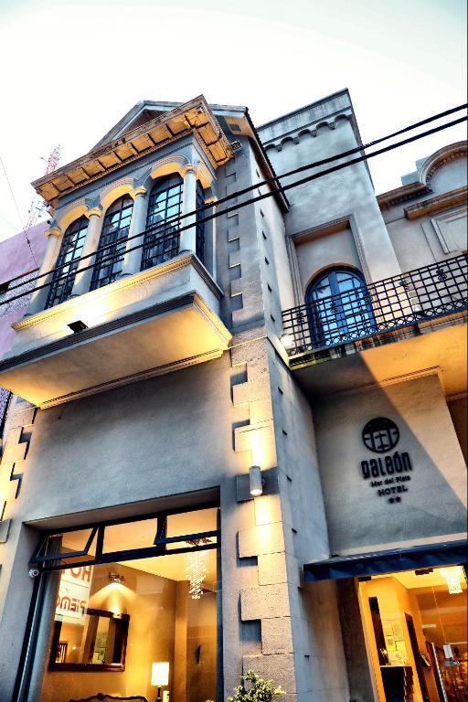 a building with a sign on the side of it at Galeon Mar del Plata Hotel in Mar del Plata