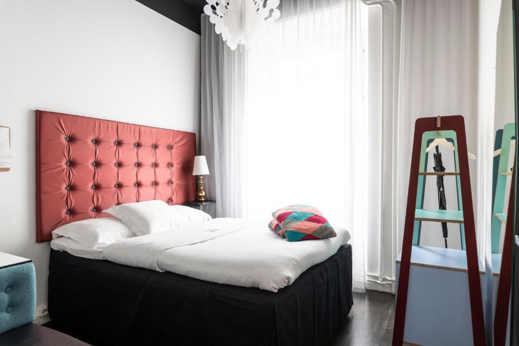 Postel nebo postele na pokoji v ubytování Hotel Flora