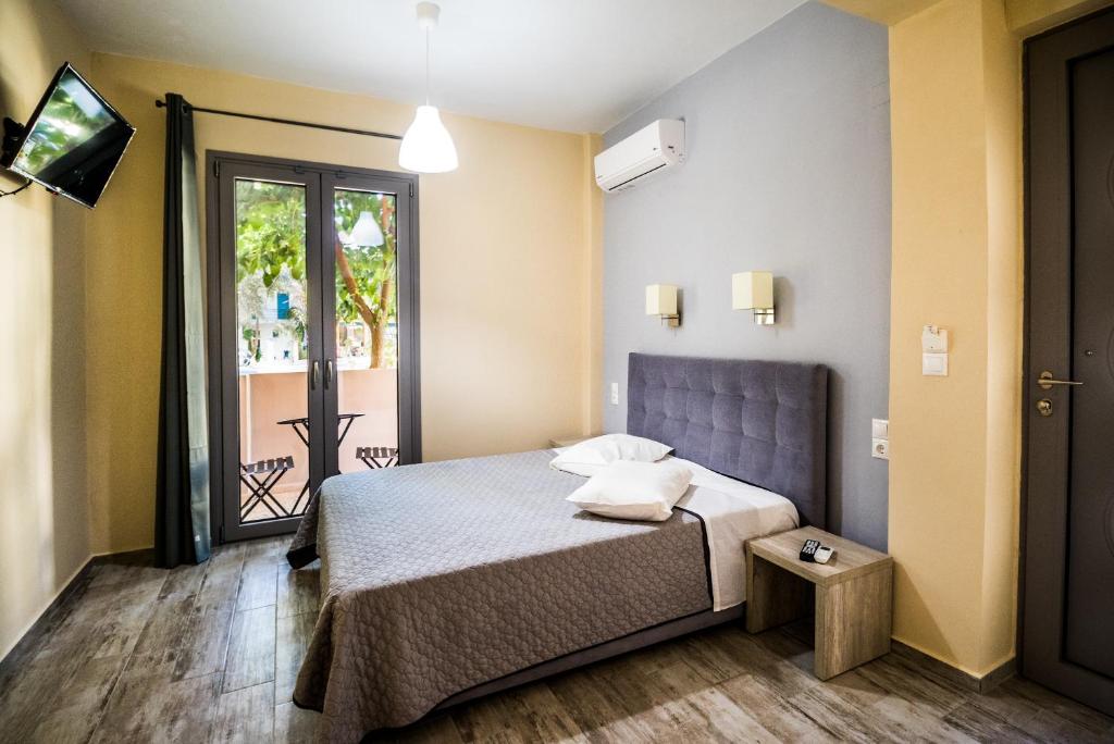 A bed or beds in a room at Nefeli
