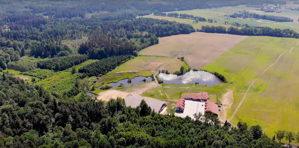 an aerial view of a house in the middle of a field at AgroBorcz in Borcz