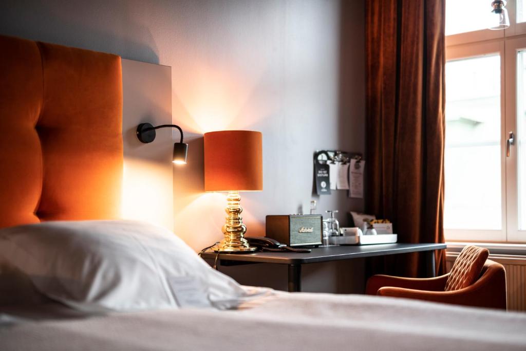Postel nebo postele na pokoji v ubytování Hotel Flora