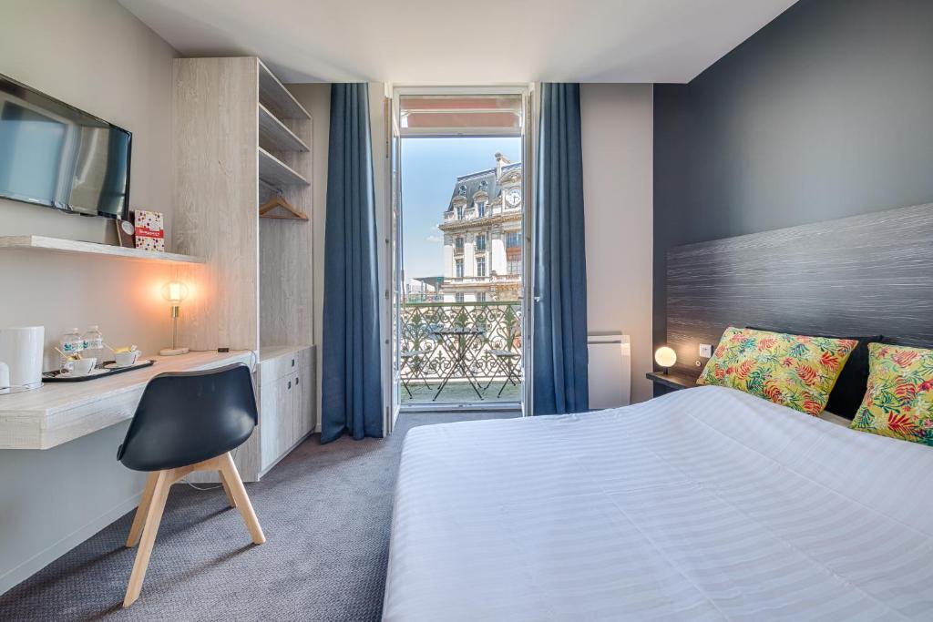 a hotel room with a bed and a window at BDX Hôtel - Gare Saint-Jean in Bordeaux