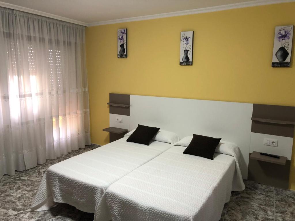 Postel nebo postele na pokoji v ubytování Pension Casa Prieto