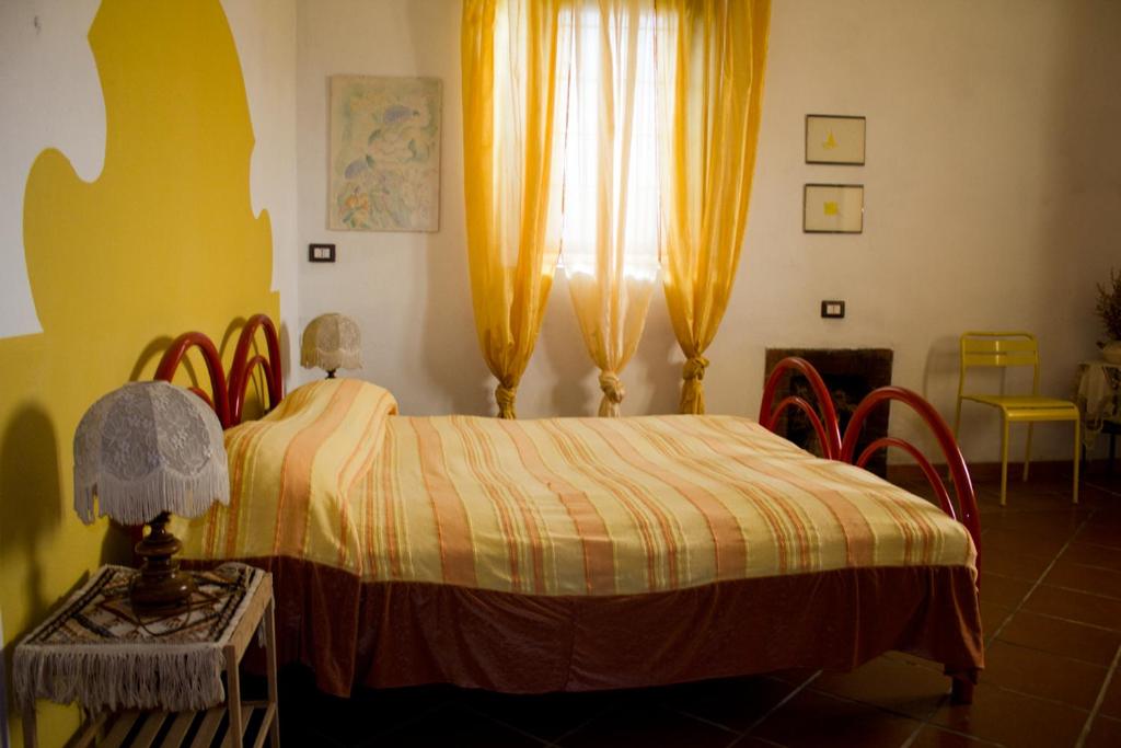 Postel nebo postele na pokoji v ubytování Villa Lancellotti