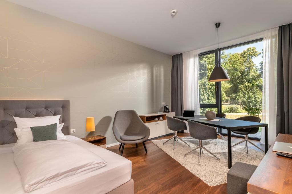 Postel nebo postele na pokoji v ubytování Hotel Melchior Park