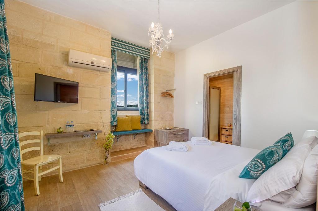 Łóżko lub łóżka w pokoju w obiekcie Point de vue Guesthouse