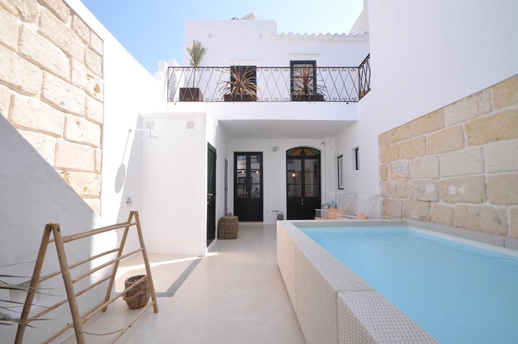 a villa with a swimming pool and a house at LLONGA'S 11th in Ciutadella