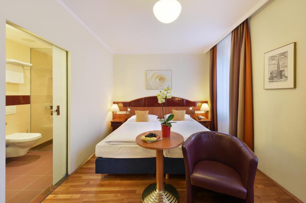 Postel nebo postele na pokoji v ubytování Austria Classic Hotel Wien