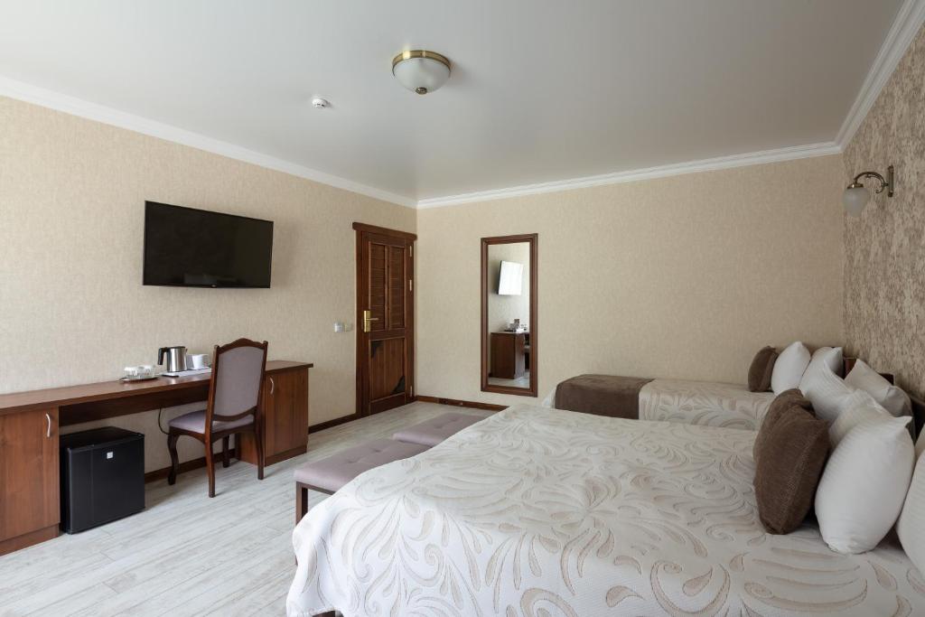 Postel nebo postele na pokoji v ubytování Carparosa Hotel