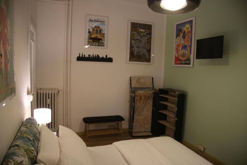A bed or beds in a room at Mila Guest House