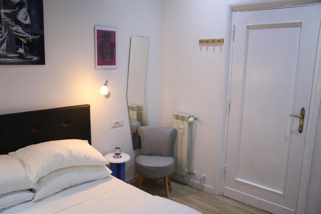 A bed or beds in a room at Mila Guest House